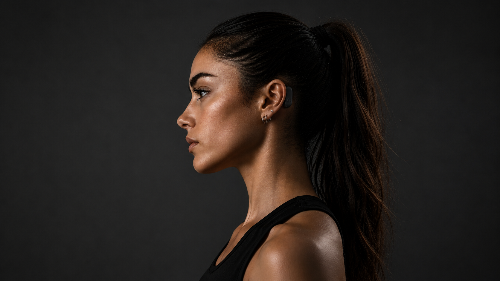 Alpha Bubble worn behind the ear — the original portrait.